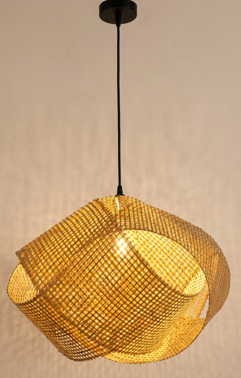 A pendant light unit with an intricate geometric design made of natural bamboo that wraps smoothly, mimicking seashells, to distribute warm shadows with a unique natural touch in the space.