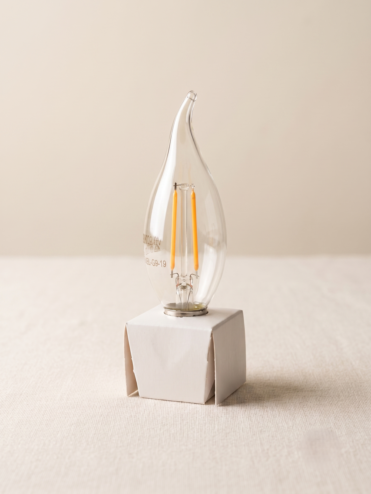 LED filament lamp with a tip-shaped design inspired by a water droplet.