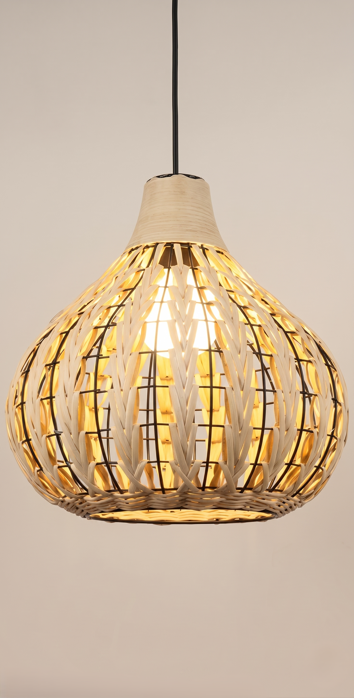A "bohemian" style pendant light unit based on a metal frame covered with woven bamboo.