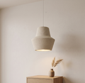 A pendant ceiling lamp with a simple design and a rough, earthy texture, adding a warm and comfortable natural touch to interior spaces.
