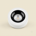 White surface-mounted spotlight with black interior bezel